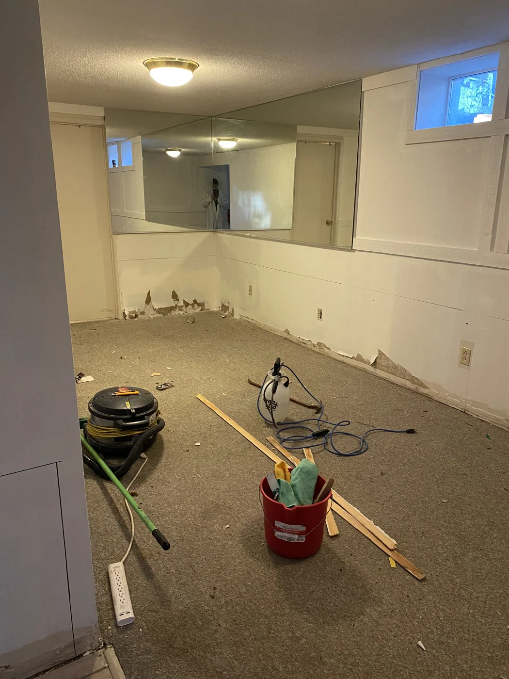 Room before water-damaged drywall removal